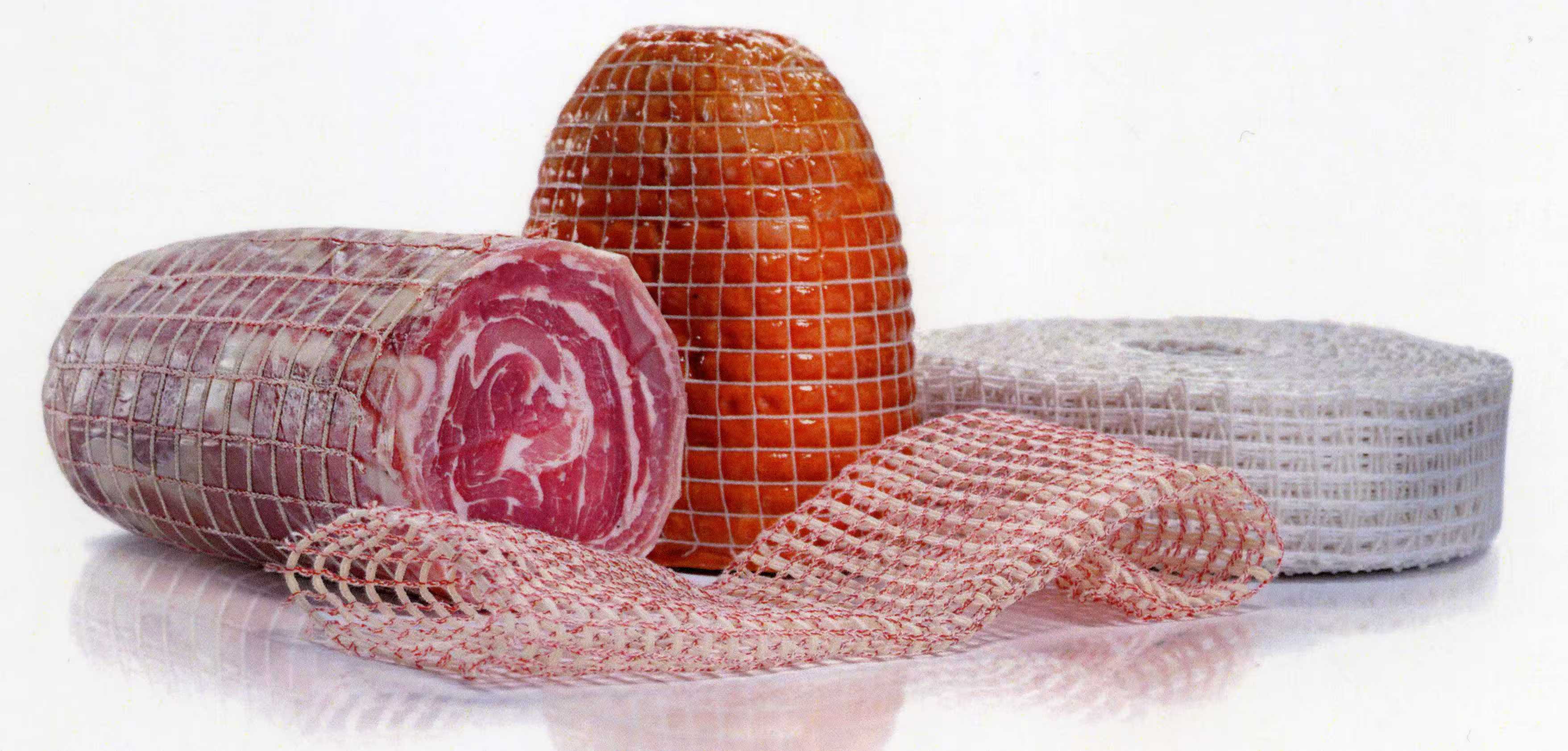 Finished netted roasts displayed beside rolls of elastic meat netting
